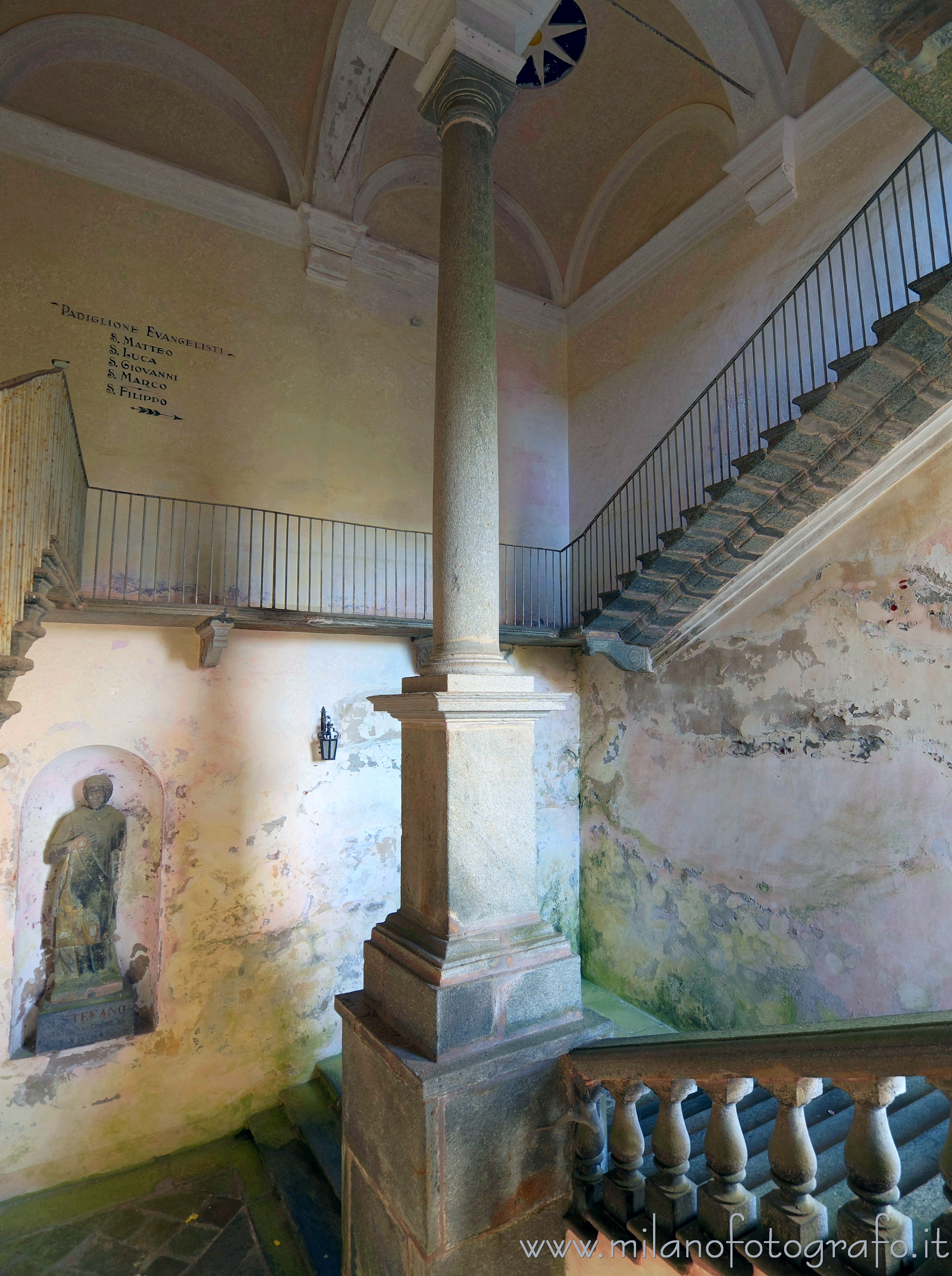 Biella (Italy) - Stairway in the upper courtyard of the Sanctuary of Oropa with the mysterious statue of Saint Stephen